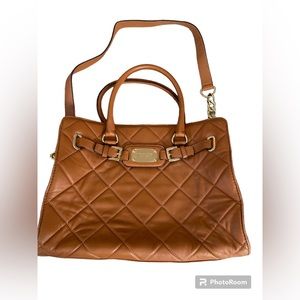Michael Kors purse. Chain strap. Buckle front. Brown quilt. Lots of storage!